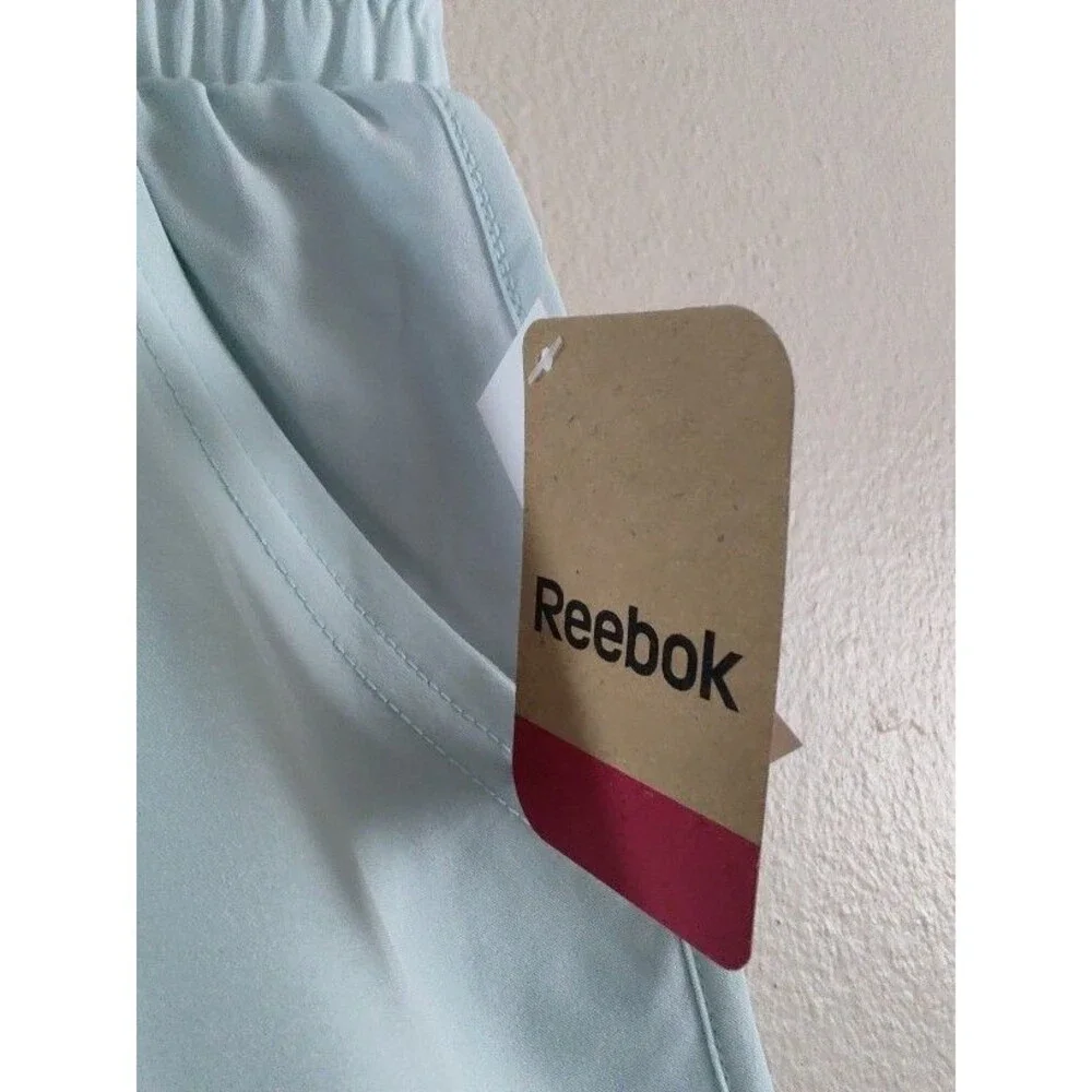 New with tags Women's Reebok Gym Workout Athletic Light Blue Shorts Size L / G